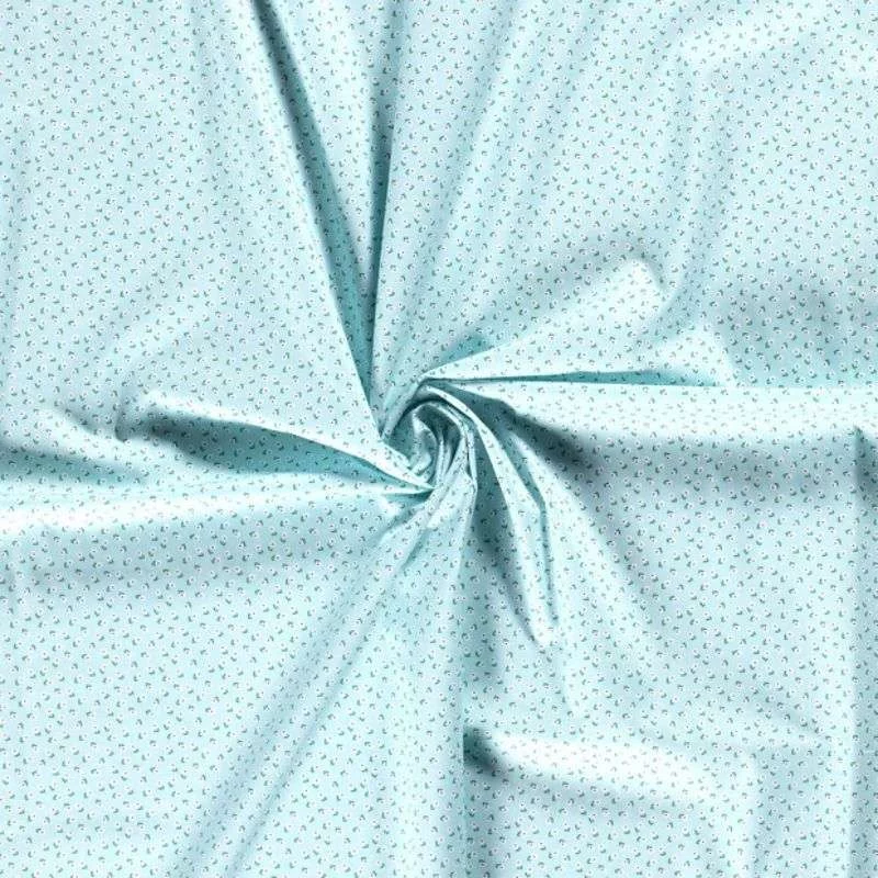 Tissu coton Popeline thème champs de fleurs sur bleu clair