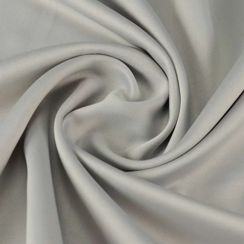 Tissu satin polyester uni gris toucher peau de pèche vendu au coupon