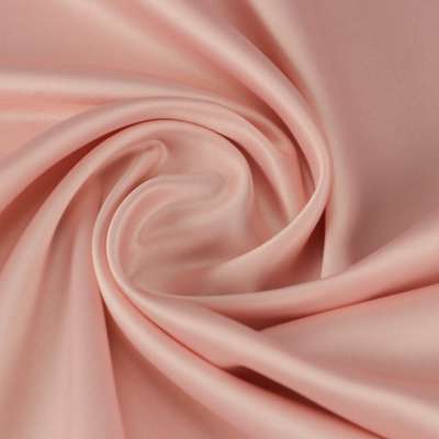 Tissu satin polyester uni rose bébé toucher peau de pèche vendu au coupon