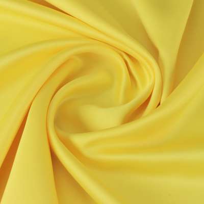 Tissu satin polyester uni jaune toucher peau de pèche vendu au coupon