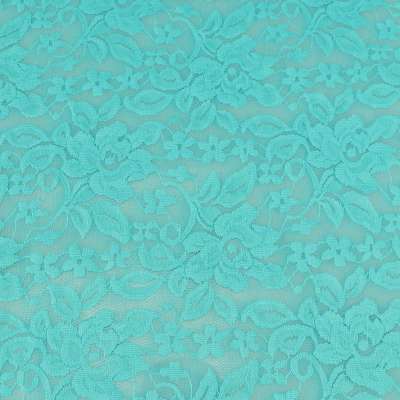Tissu dentelle motif fleurs uni turquoise