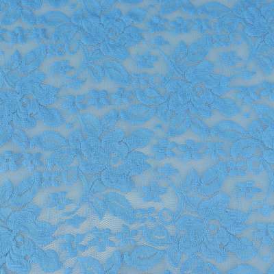 Tissu dentelle motif fleurs uni bleu