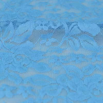 Tissu dentelle motif fleurs uni bleu vendu au coupon