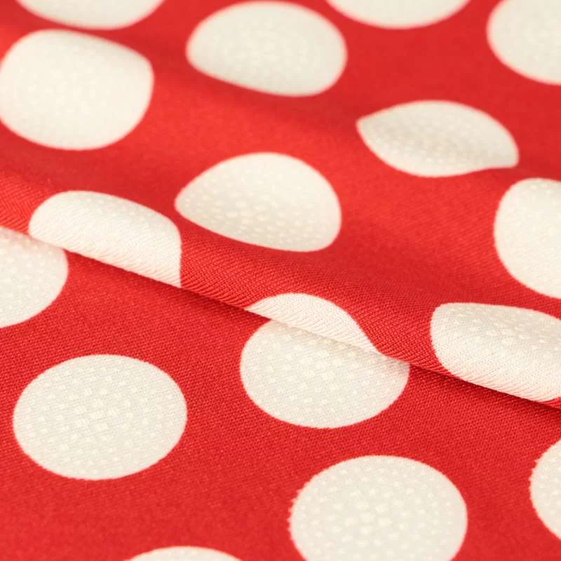 Tissu venezia gomme lycra maillot de bain motif gros pois blanc sur fond rouge