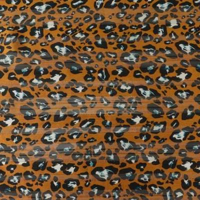 Tissu mousseline Oslo a motif léopard sur fond moutarde
