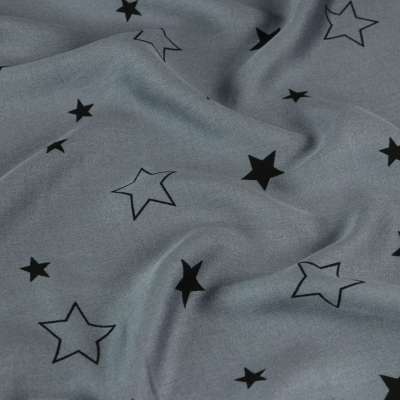 Fibranne viscose imprimé motif a étoiles  sur fond bleu ciel vendu au coupon