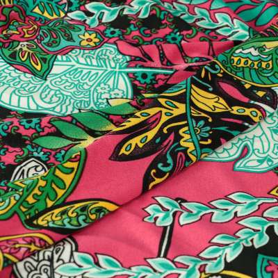 Tissu venezia lycra maillot de bain motif feuilles tropicale sur fond rose vendu au coupon