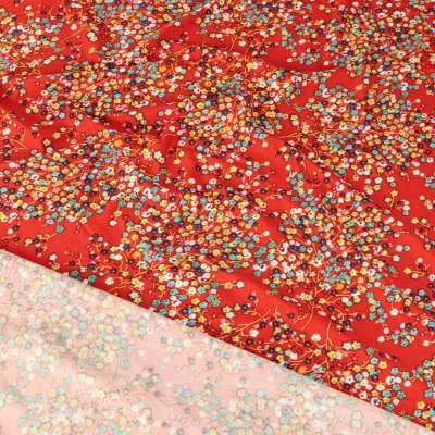 Tissu lycra maillot de bain motif fleurs printemps sur fond rouge