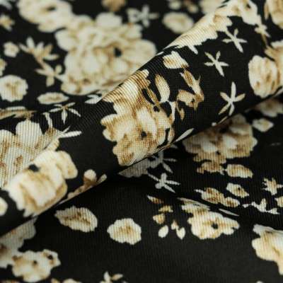 Tissu venezia lycra maillot de bain noir motif fleurs beige vendu au coupon