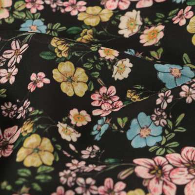 Tissu polyester noir imprimé floral vendu au coupon