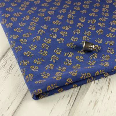 Jersey Coton imprimé fleurs sur fond bleu vendu au coupon