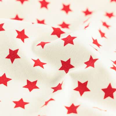 Tissus gabardine de coton blanc étoiles rouge vendu au coupon