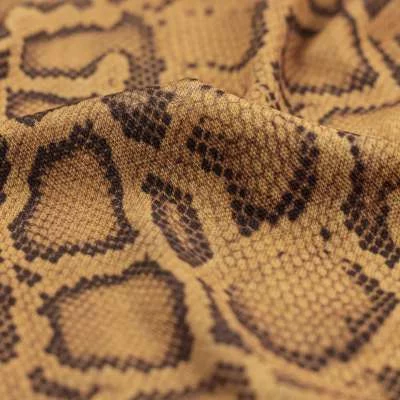 Tissus maille imprimé légère motifs python vendu au coupon