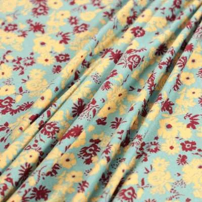 Tissu kimo bleu ciel motif fleurs au toucher très doux vendu au coupon