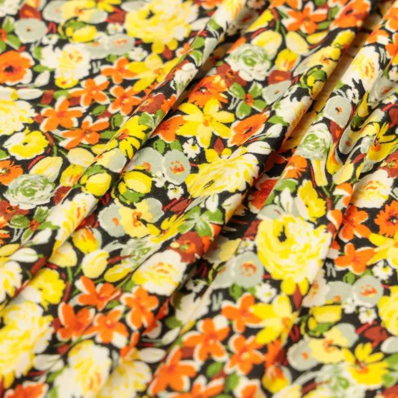 Tissu kimo noir motif champs de fleurs au toucher très doux vendu au coupon