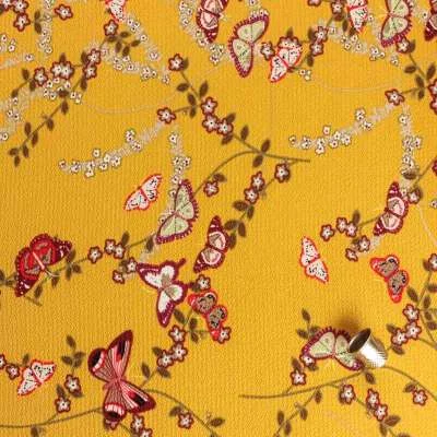 crêpe bubble moutarde motif petites branches à fleurs et papillon