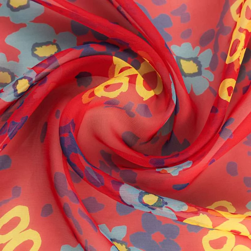 Tissu mousseline de soie motif fleurs sur fond rouge de haut gamme
