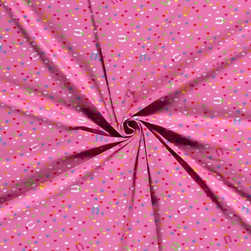 Tissus jersey coton rose imprimé cœurs multicolores vendu au coupon