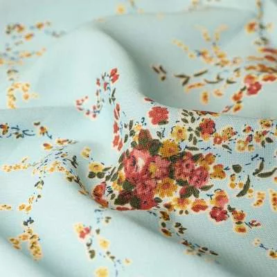 Tissu Microfibre Wool peach Imprimé Bouquet de fleurs Fond Bleu Ciel Vendu Au Coupon