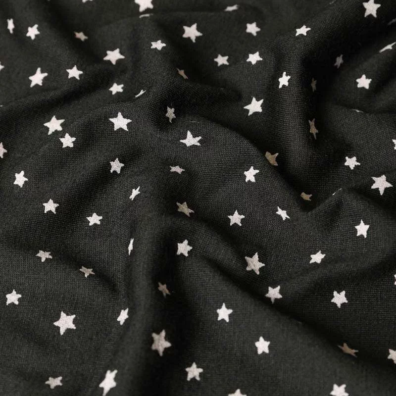 Jersey Polyester noir motif étoiles vendu au coupon