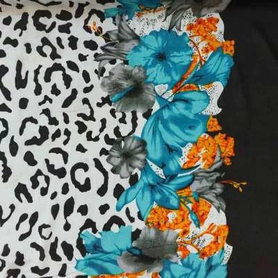 Tissu viscose base fleurs bleu motif léopard vendu au coupon