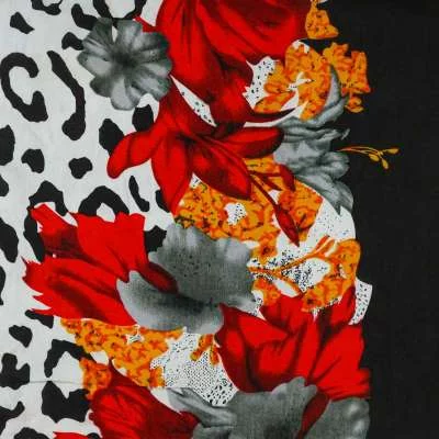 Tissu viscose base fleurs rouges motif léopard vendu au coupon