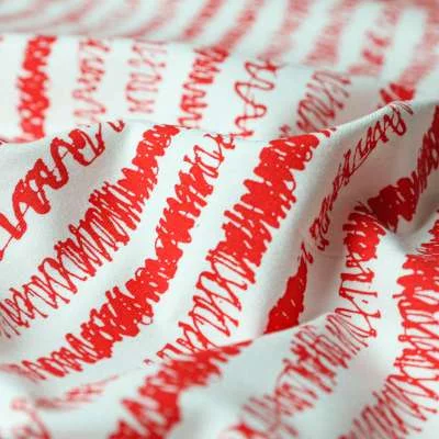 Jersey coton imprimé rayures irrégulières rouge sur fond blanc