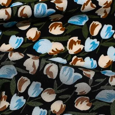 Tissu viscose de haute qualité fond noir motif tulipes bleu vendu au coupon