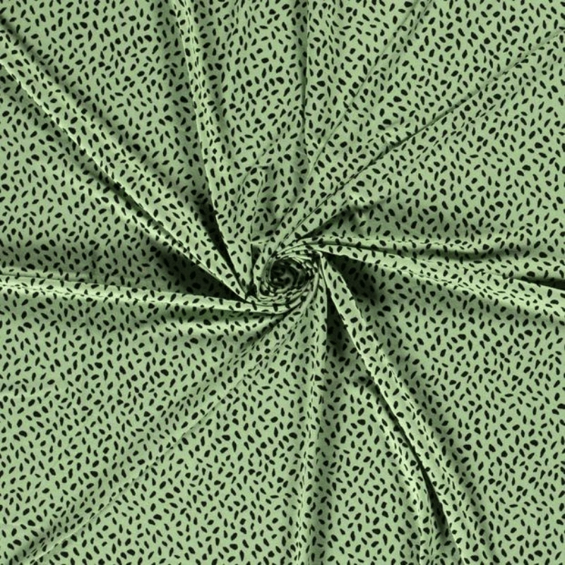 Tissu jersey de viscose imprimé taches noir fond vert