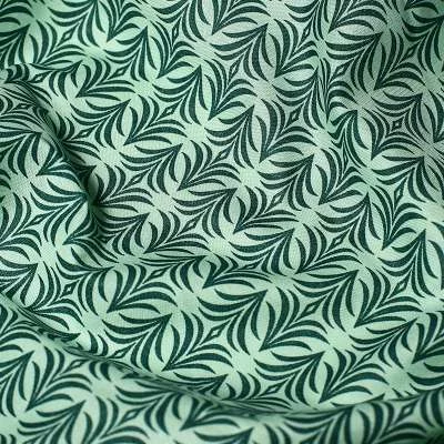 Popeline de Coton motif graphique sur fond vert vendu au coupon