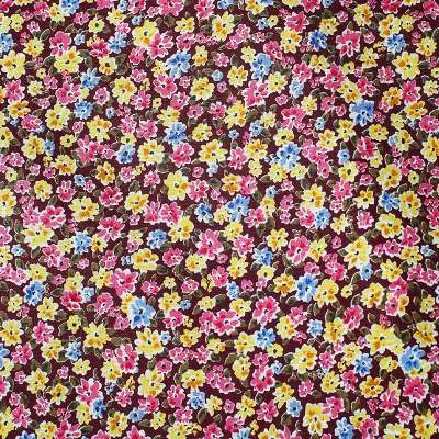 Popeline de Coton motif champs de fleurs sur fond bordeaux idéale pour des créations originales.