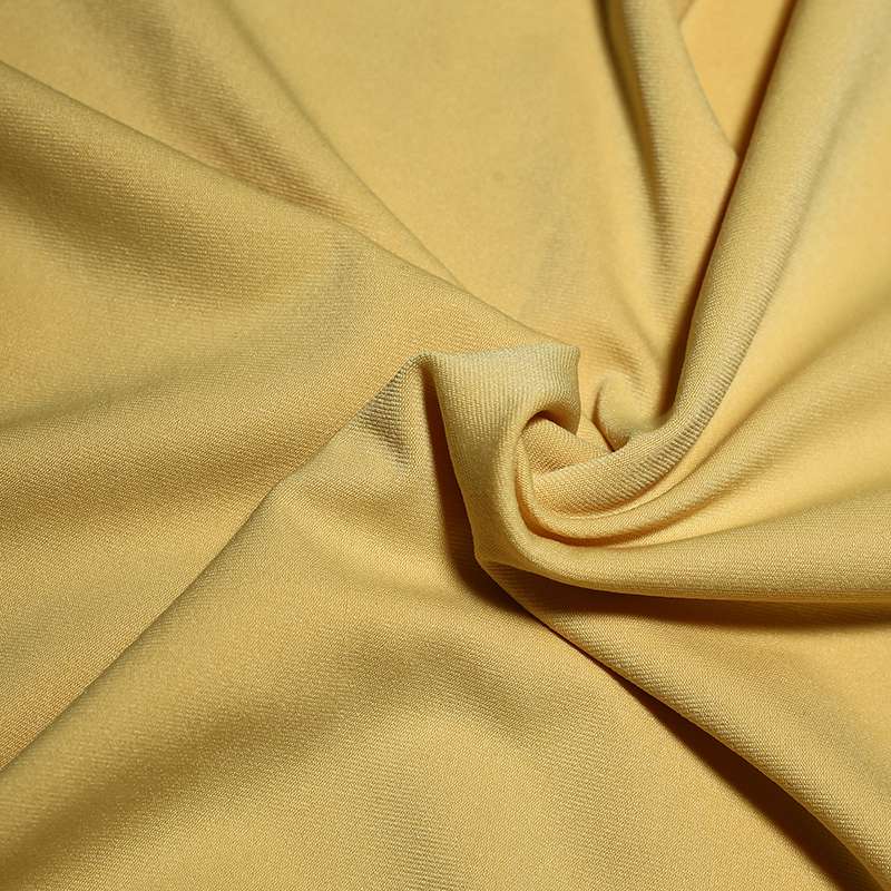 Tissu jersey polyester uni jaune vendu au coupon