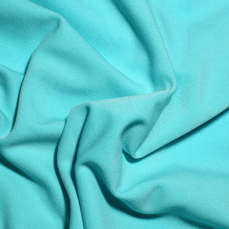 Tissu jersey polyester uni aqua vendu au coupon