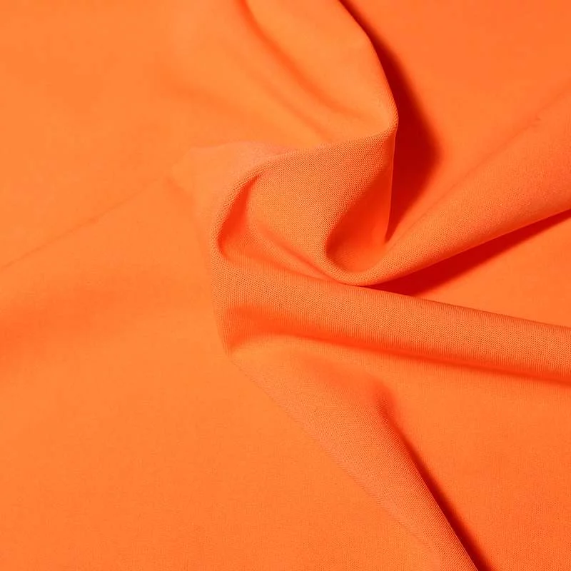 Tissu jersey polyester uni orange vendu au coupon uni en différentes couleurs