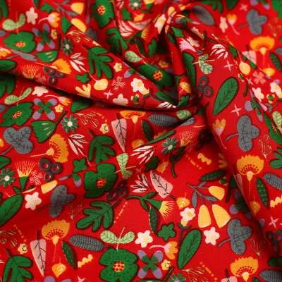 Tissu Crêpe De Polyester Motifs fleurs Fond rouge vendu au coupon