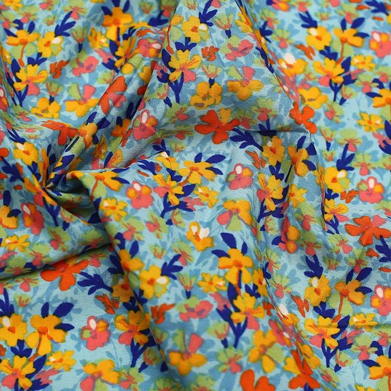 Tissu crêpe polyester motifs fleurs des champs Fond jaune vendu au coupon