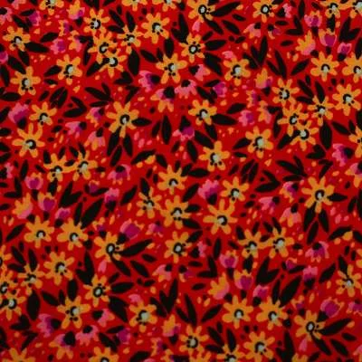 Tissu crêpe polyester imprimé fleuris fond rouge vendu au coupon