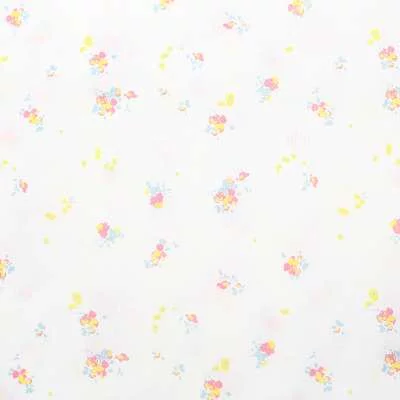 Popeline de coton blanc imprimé fleurs : douceur et légèreté