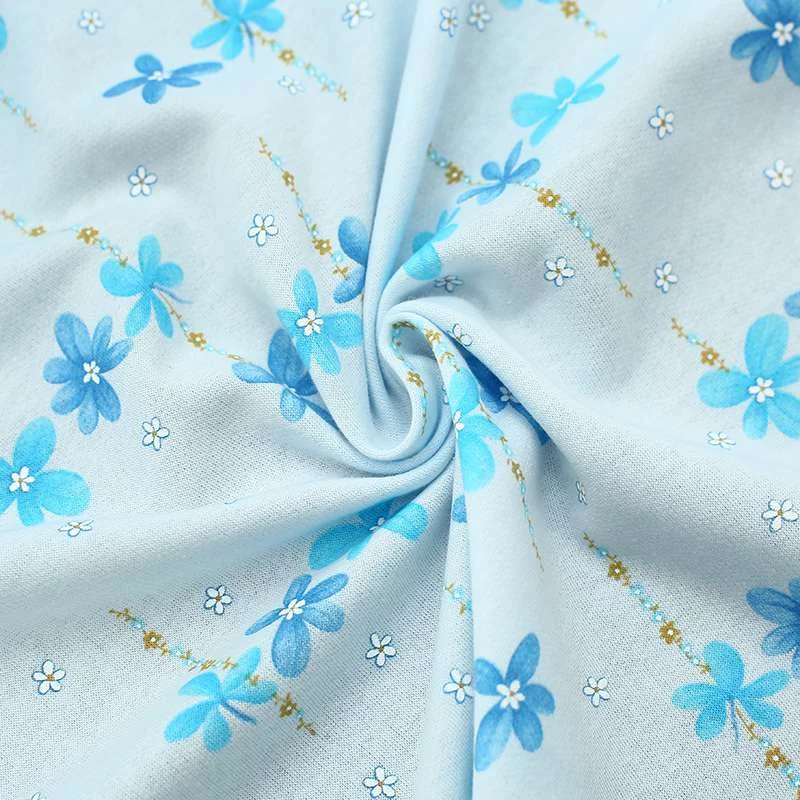 Tissu Jersey Coton imprimé fleurs : Fond bleu bébé | Mode et confort