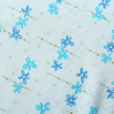 Tissu Jersey Coton imprimé : Fleurs sur fond bleu bébé | Acheter en ligne