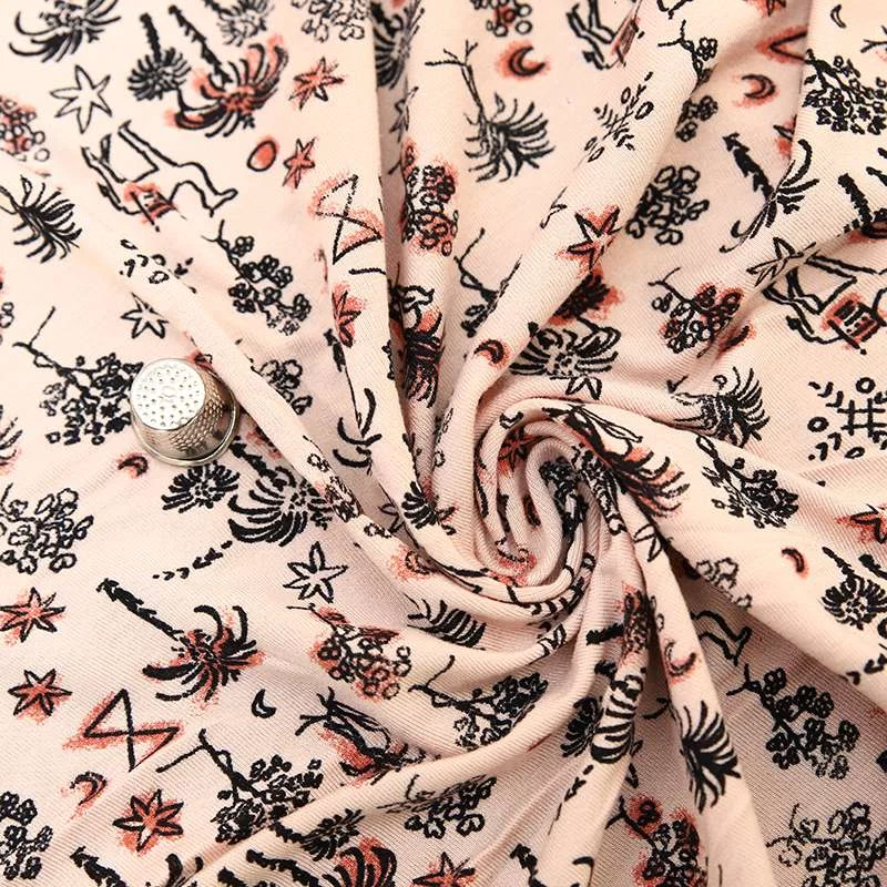 Tissu Jersey rose avec Imprimé Oasis - Confort et Fraîcheur Réunis