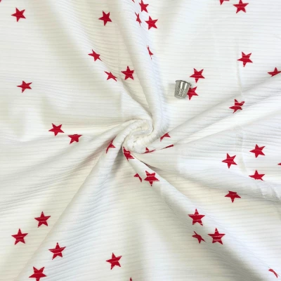 Tissu velours côtelé motif étoile pour jupes sophistiquées