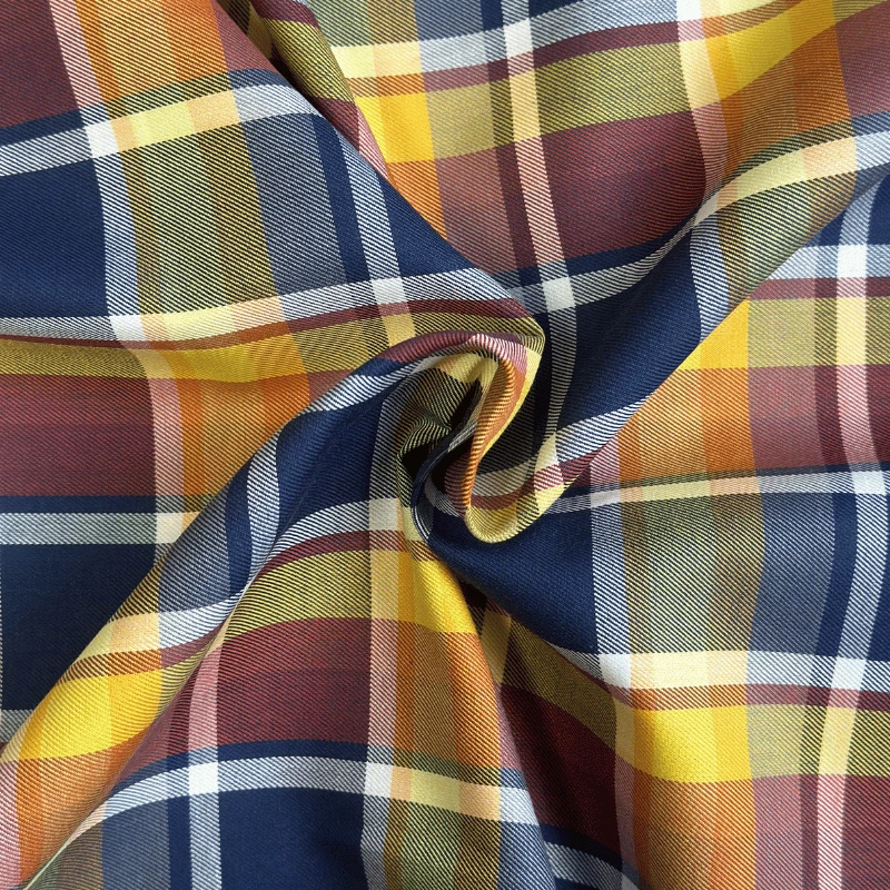 Tissu à carreaux bleus, marron et jaune pour chemises