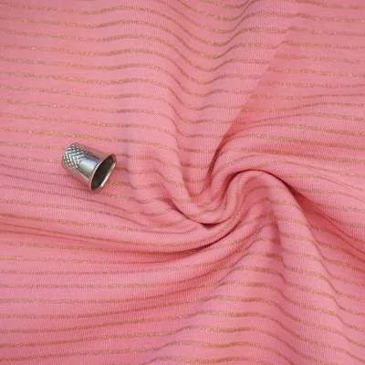 Tissu jersey pour mode féminine en coton rose à rayures lurex or.