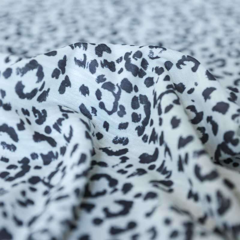 Tissu jersey léopard blanc et noir pour jupes