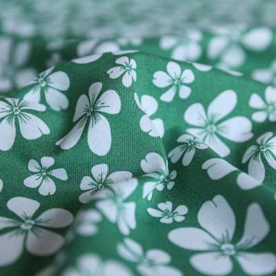 Fibranne viscose imprimé à motif floral blanc sur fond vert