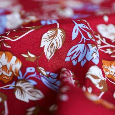 Tissu viscose fibranne rouge avec motifs floraux colorés