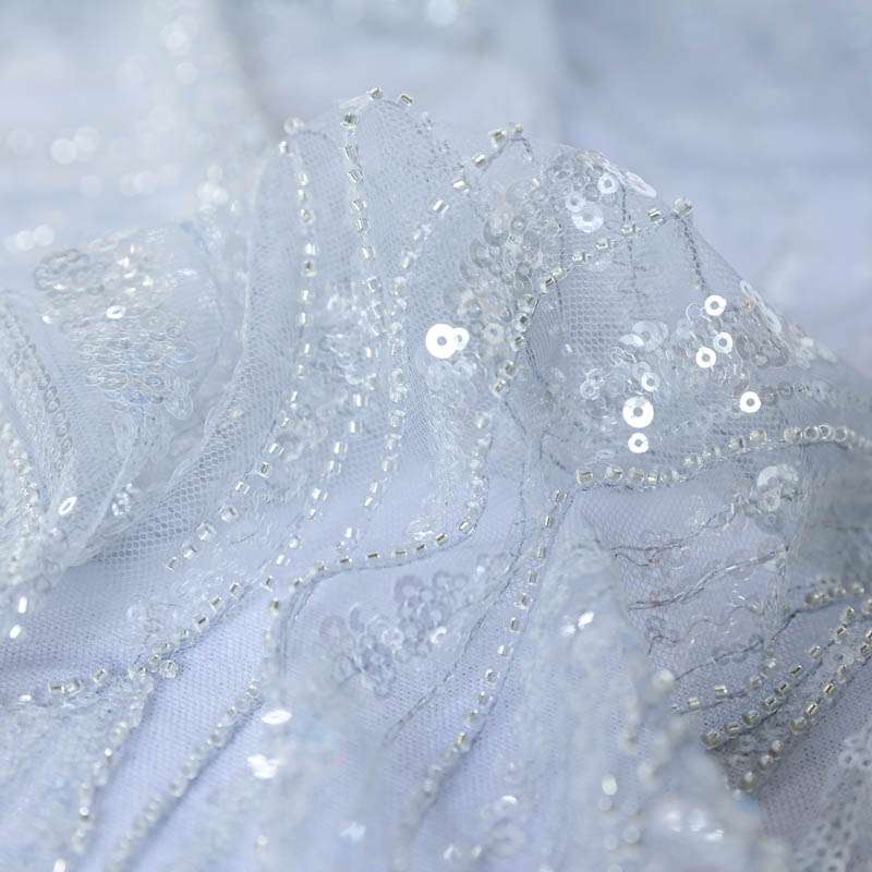 Dentelle blanche à paillettes pour confection de robes de soirée