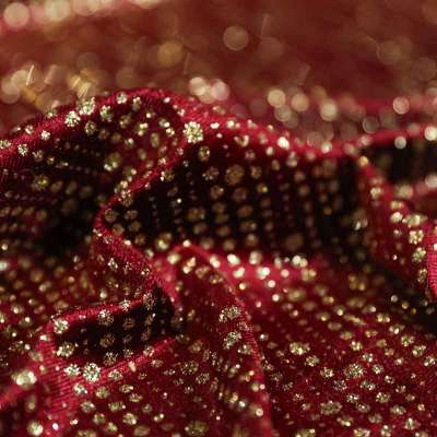 Tissu velours paillettes bordeaux pour des vêtements de fête