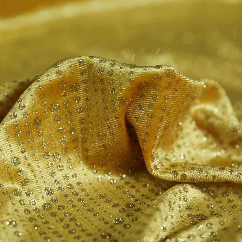 Le tissu velours paillettes avec effet brillant doré